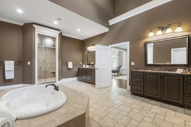 3 Newton Ln, Medway, MA 02053 - bathroom with crown molding, a stall shower, a jetted tub, two vanities, and baseboards