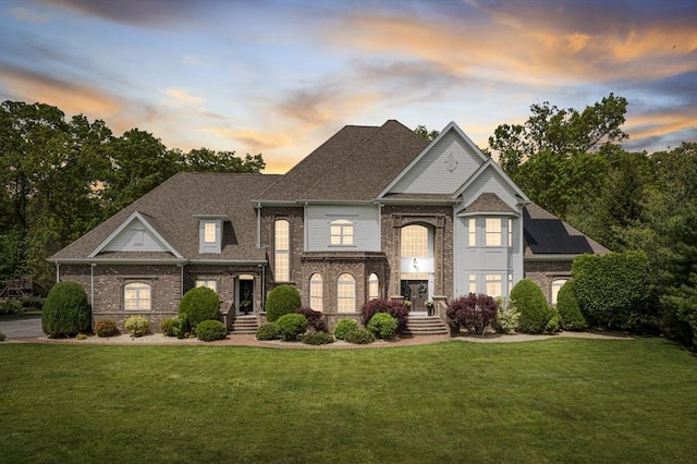 3 Newton Ln, Medway, MA 02053 - french country style house featuring a yard, brick siding, french doors, and a shingled roof