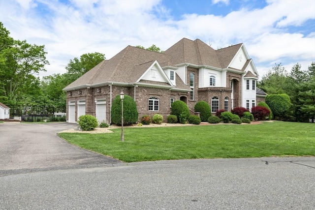 3 Newton Ln, Medway, MA 02053 - view of front facade featuring driveway, brick siding, and a front yard