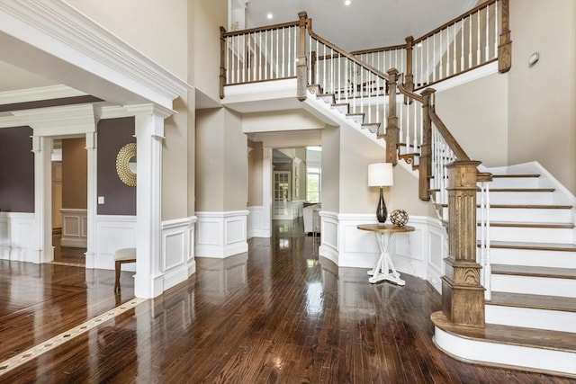 3 Newton Ln, Medway, MA 02053 - entrance foyer with wood-type flooring, wainscoting, stairway, decorative columns, and a towering ceiling