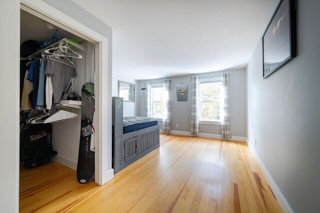 hallway with wood-type flooring