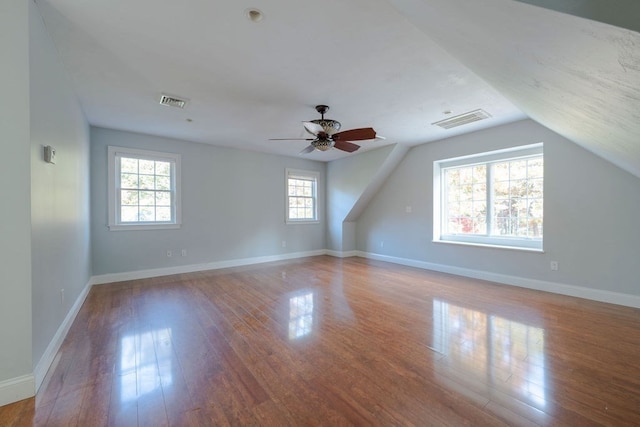 bonus room featuring lofted ceiling, hardwood / wood-style flooring, and ceiling fan