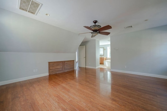 bonus room featuring ceiling fan, wood-type flooring, and vaulted ceiling