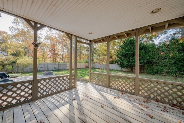 wooden deck featuring a fire pit