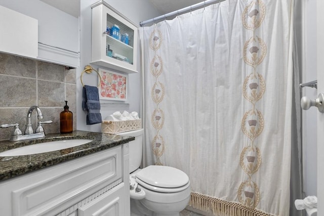 12 Pond Ln Unit 65, Arlington, MA 02474 - bathroom with toilet, decorative backsplash, and vanity