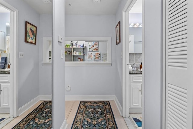 12 Pond Ln Unit 65, Arlington, MA 02474 - corridor with light wood finished floors and baseboards