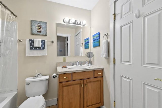 bathroom featuring toilet, shower / tub combo with curtain, and vanity