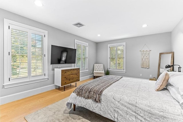 bedroom with hardwood / wood-style flooring