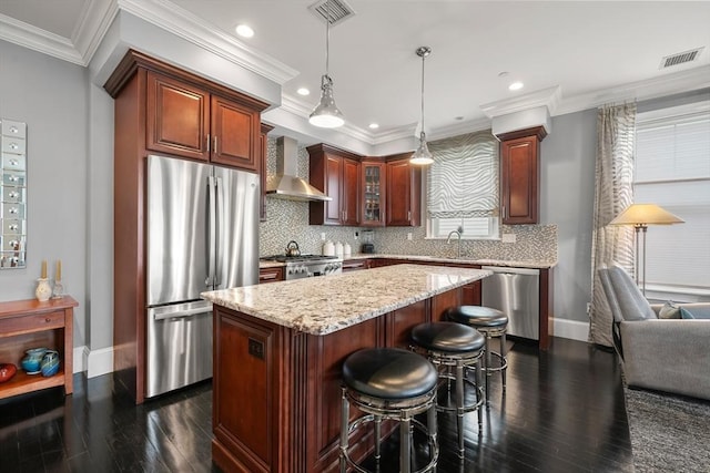 615 E 6th St Unit 6, Boston, MA 02127 - kitchen with stainless steel appliances, wall chimney exhaust hood, baseboards, dark wood-style floors, and recessed lighting