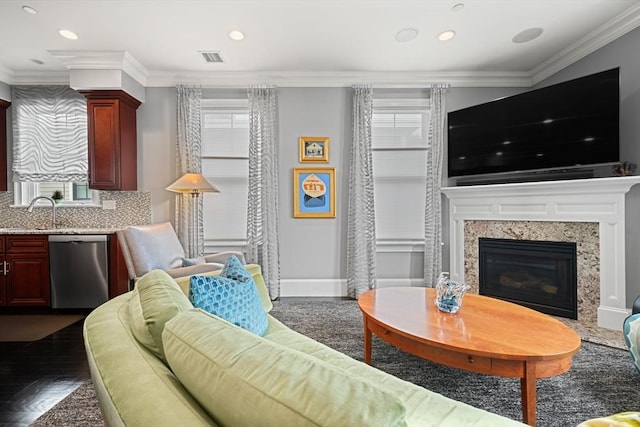 615 E 6th St Unit 6, Boston, MA 02127 - living area with healthy amount of natural light, crown molding, recessed lighting, a fireplace, and dark wood finished floors