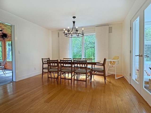 187 Plain Rd, Greenfield, MA 01301 - dining space featuring light wood-style floors, healthy amount of natural light, a chandelier, and baseboards