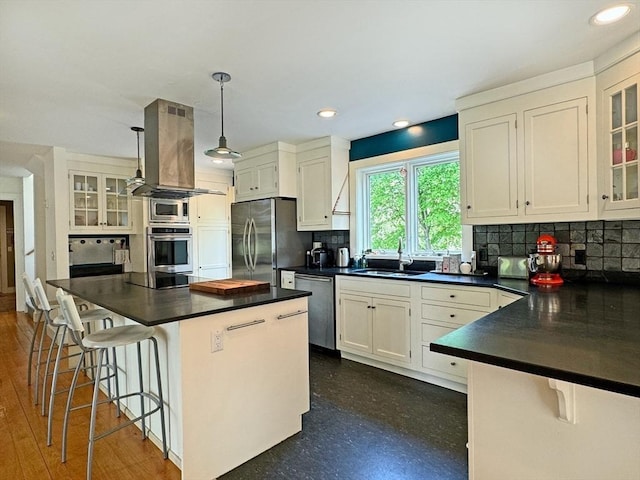 187 Plain Rd, Greenfield, MA 01301 - kitchen featuring appliances with stainless steel finishes, dark countertops, a sink, decorative backsplash, and recessed lighting