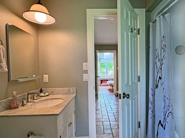 187 Plain Rd, Greenfield, MA 01301 - full bathroom with stone tile floors, vanity, baseboards, and curtained shower