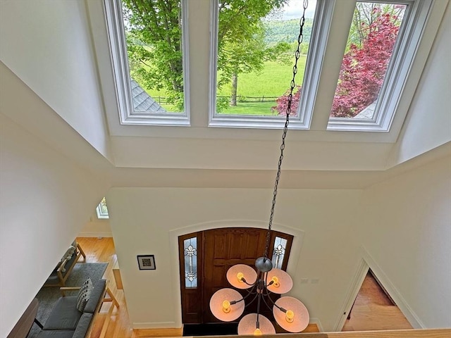 187 Plain Rd, Greenfield, MA 01301 - foyer featuring wood finished floors, a chandelier, and a high ceiling