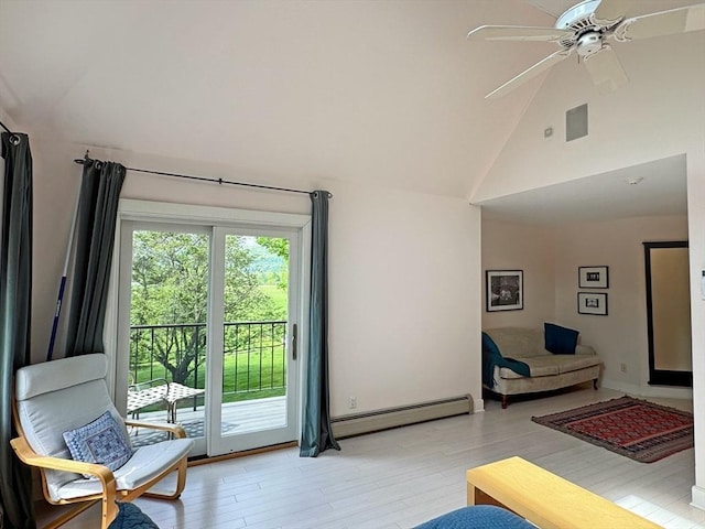 187 Plain Rd, Greenfield, MA 01301 - living room featuring a baseboard heating unit, light wood finished floors, a ceiling fan, and high vaulted ceiling