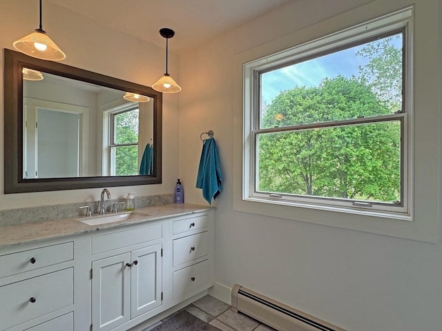 187 Plain Rd, Greenfield, MA 01301 - bathroom with baseboard heating, vanity, baseboards, and tile patterned flooring