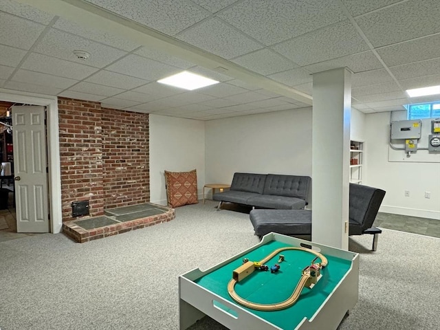 187 Plain Rd, Greenfield, MA 01301 - game room with carpet floors, a paneled ceiling, a wood stove, and baseboards