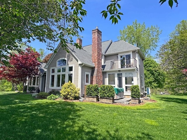 187 Plain Rd, Greenfield, MA 01301 - back of house featuring a balcony, a lawn, and a chimney