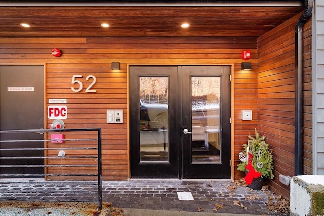 view of exterior entry featuring french doors