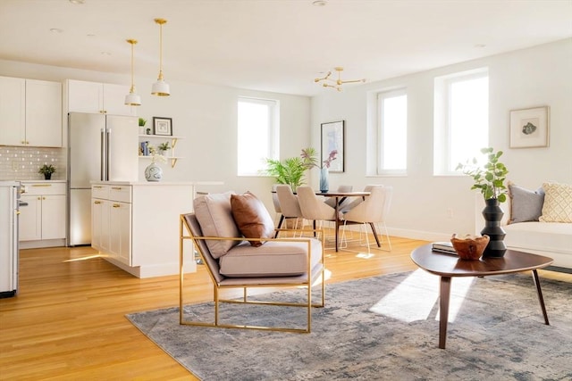 living room with light hardwood / wood-style flooring