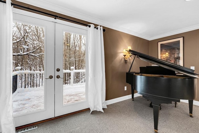 sitting room with crown molding and french doors