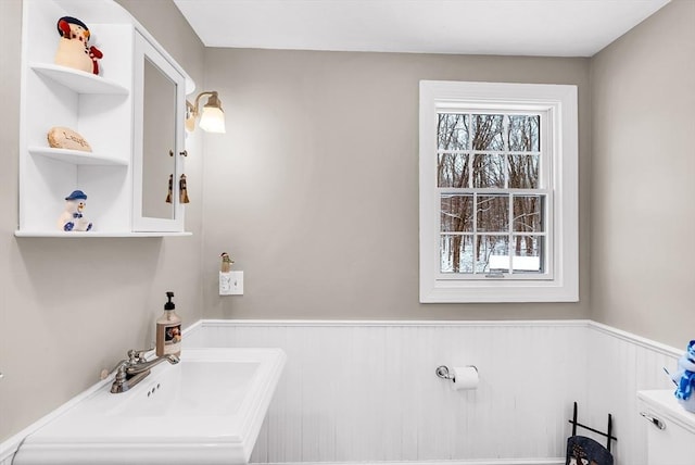 bathroom featuring sink and toilet