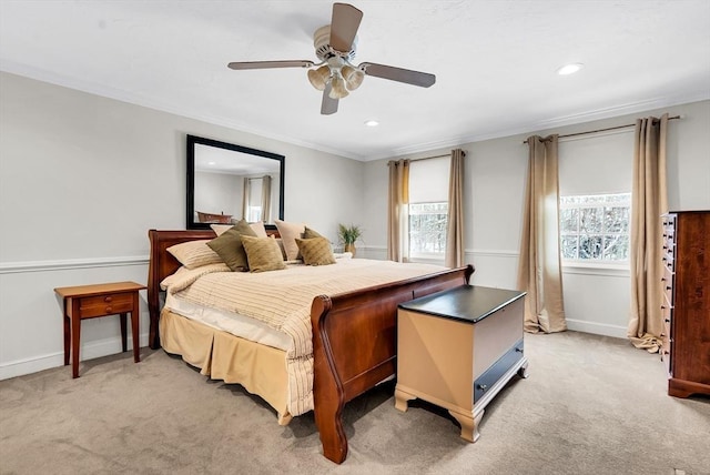 bedroom featuring light colored carpet, ceiling fan, and ornamental molding