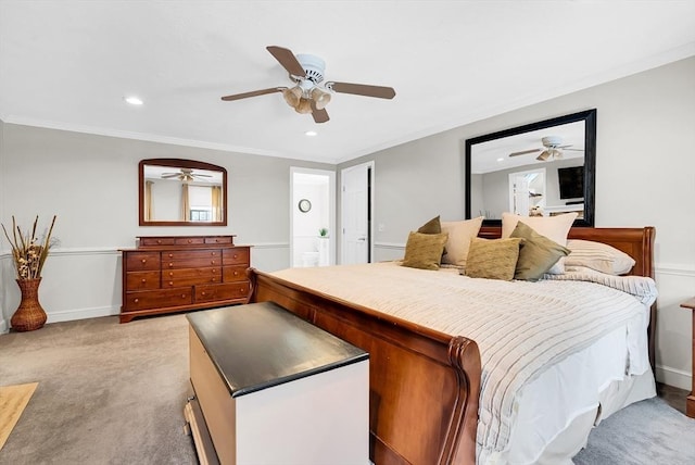 carpeted bedroom featuring ceiling fan and ornamental molding