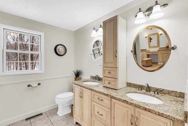 bathroom featuring tile patterned floors, toilet, vanity, and crown molding