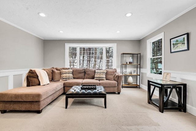 carpeted living room featuring crown molding