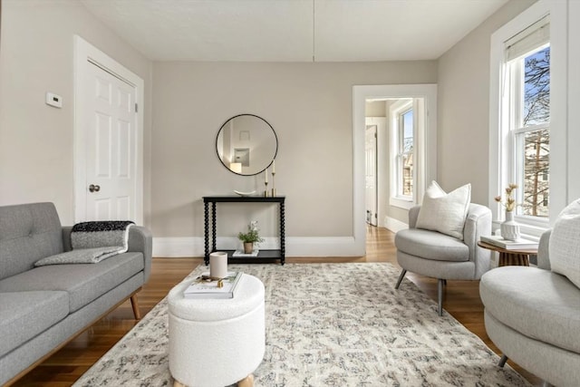 living room with wood finished floors and baseboards