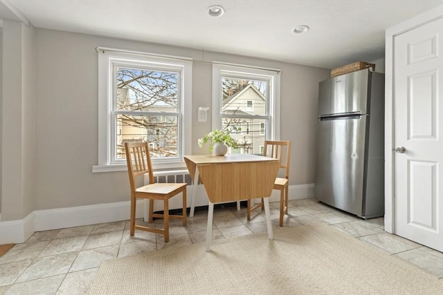 dining area featuring recessed lighting, baseboards, and light tile patterned floors