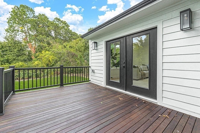 wooden deck featuring french doors