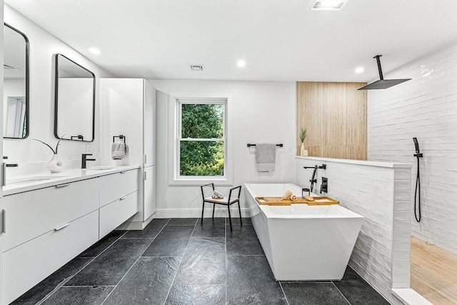 bathroom with plus walk in shower and vanity