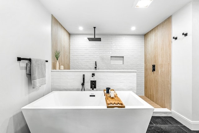 bathroom featuring independent shower and bath and tile patterned flooring