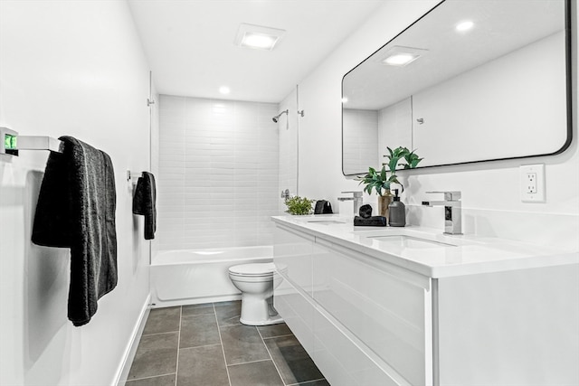 full bathroom with vanity, tiled shower / bath combo, toilet, and tile patterned flooring