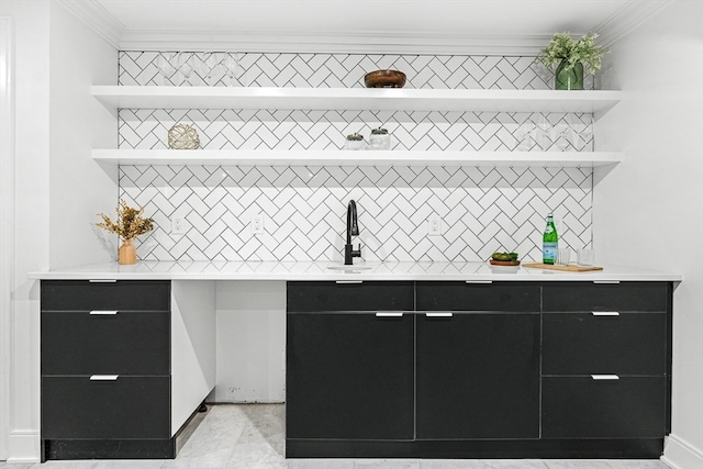 bar featuring crown molding, sink, and tasteful backsplash