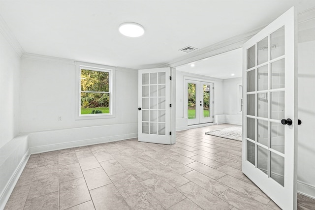 unfurnished room with crown molding and french doors