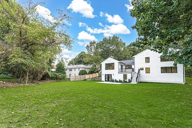 rear view of house with a lawn