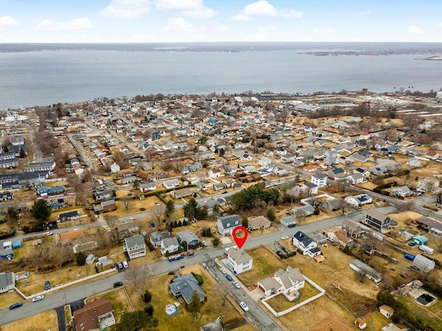 bird's eye view with a water view and a residential view