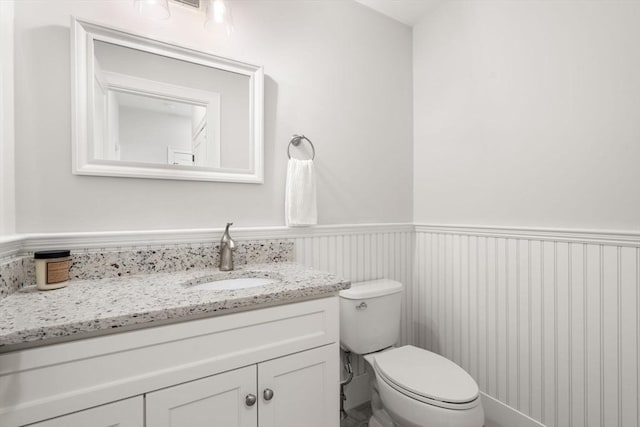 15 Boydes Xing Unit 13, Norfolk, MA 02056 - bathroom with wainscoting, vanity, and toilet