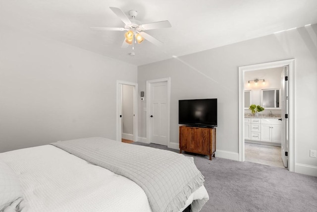 15 Boydes Xing Unit 13, Norfolk, MA 02056 - bedroom featuring light carpet, baseboards, ensuite bath, and a sink