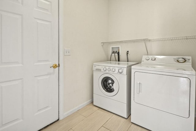 28 Summerfield Dr Unit 28, Grafton, MA 01560 - washroom featuring washing machine and clothes dryer and baseboards