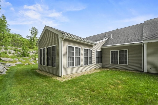 28 Summerfield Dr Unit 28, Grafton, MA 01560 - rear view of property featuring a yard and roof with shingles