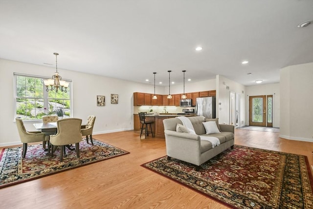 28 Summerfield Dr Unit 28, Grafton, MA 01560 - living area with a chandelier, light wood finished floors, plenty of natural light, baseboards, and recessed lighting