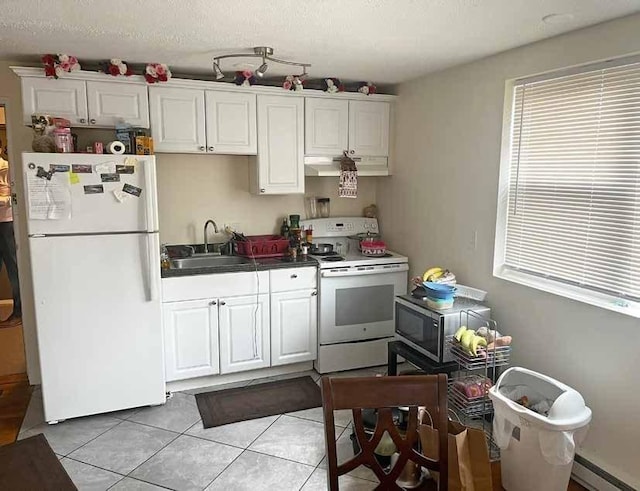 447 Pleasant St, Melrose, MA 02176 - kitchen featuring white appliances, a sink, under cabinet range hood, baseboard heating, and light tile patterned floors