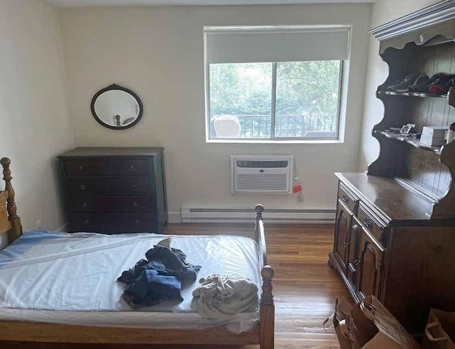 447 Pleasant St, Melrose, MA 02176 - bedroom featuring a wall mounted air conditioner and wood finished floors