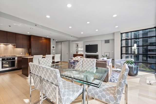 dining area with light wood-type flooring