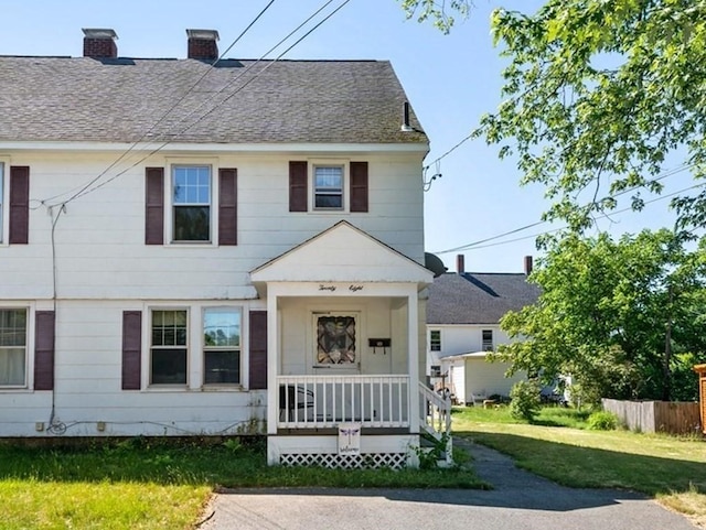 view of front of home with a front lawn and a porch