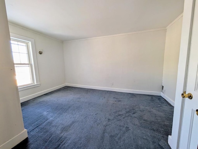 unfurnished room with dark colored carpet and crown molding